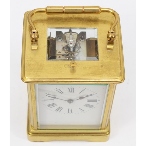 328 - A late 19th/early 20th century French brass corniche cased repeating mantle clock, the white dial wi... 