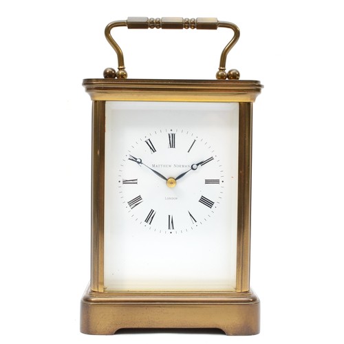 333 - Matthew Norman of London, a 20th century brass corniche and four bevelled glass carriage clock, with... 