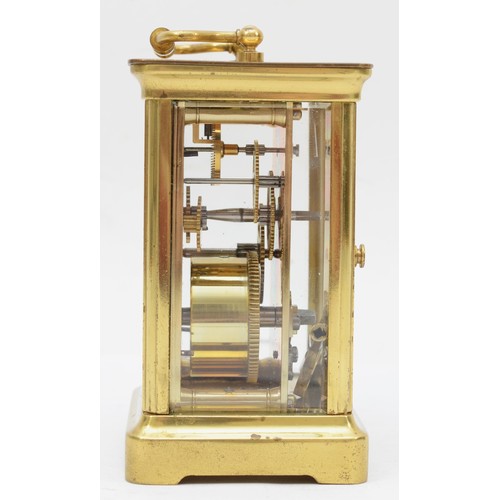 334 - A 20th century corniche brass cased and four glass carriage clock, with swing handle the white dial ... 