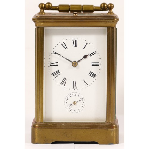 335 - An early 20th century brass corniche cased and four glass carriage clock, with swing handle, the whi... 