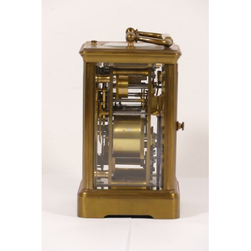 335 - An early 20th century brass corniche cased and four glass carriage clock, with swing handle, the whi... 