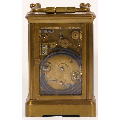 335 - An early 20th century brass corniche cased and four glass carriage clock, with swing handle, the whi... 