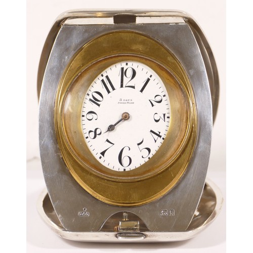 337 - A George V hallmarked silver cased eight day folding strut clock, Cohen & Charles London 1917, the w... 