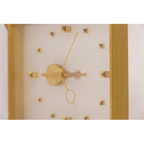 339 - Jaeger le-Coutre, a mid 20th century brass and glass cased mantle clock, the dial with applied squar... 