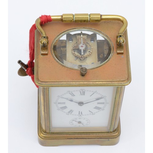 347 - A late 19th century brass corniche cased and four glass repeat striking carriage clock, with swing h... 