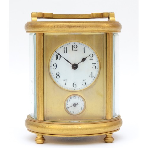 348 - A 20th century oval brass cornice cased and four glass carriage clock, with swing handle, the white ... 