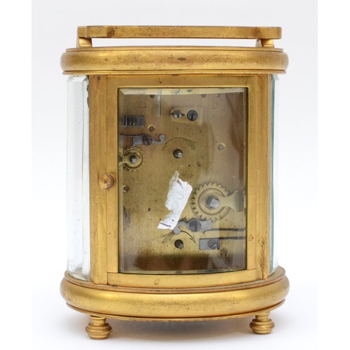 348 - A 20th century oval brass cornice cased and four glass carriage clock, with swing handle, the white ... 