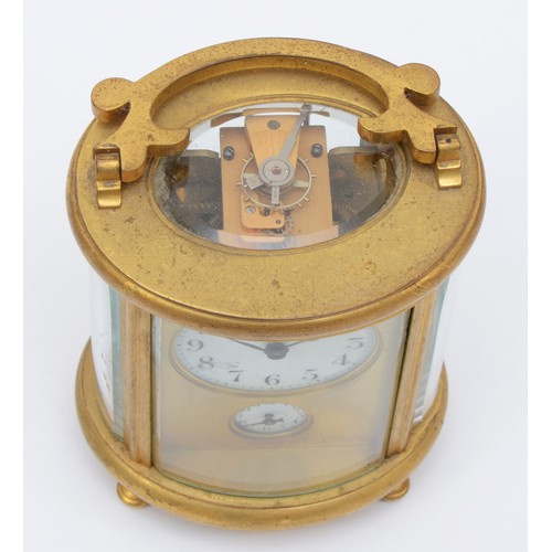 348 - A 20th century oval brass cornice cased and four glass carriage clock, with swing handle, the white ... 