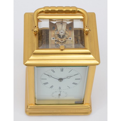 352 - A late 19th century brass corniche cased and four glass presentation striking carriage clock, with s... 