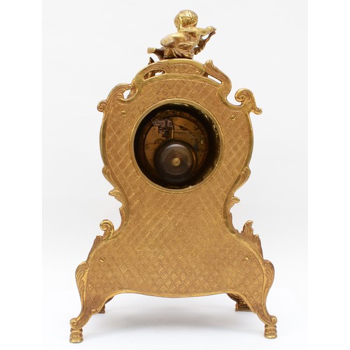 356 - Imperial, a 20th century gilt brass cartouche shaped mantle clock, cast with putti finial and acanth... 