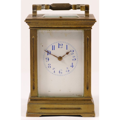 366 - An early 20th century French brass and four glass corniche cased striking carriage clock, with swing... 