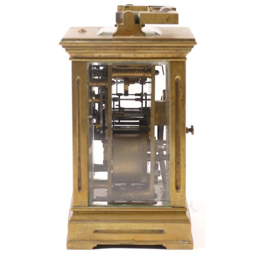 366 - An early 20th century French brass and four glass corniche cased striking carriage clock, with swing... 