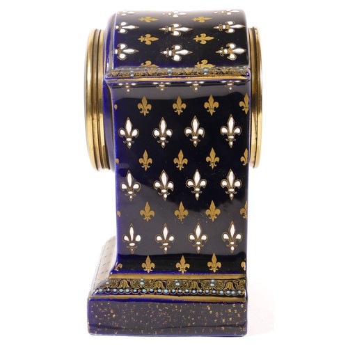 371 - An early 20th century cobalt blue cased dome topped porcelain cased mantle clock, decorated with gil... 