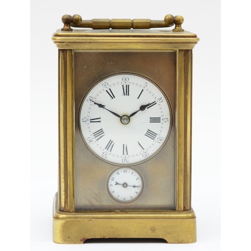 372 - An early 20th century brass and four glass corniche cased striking carriage clock, the white enamell... 