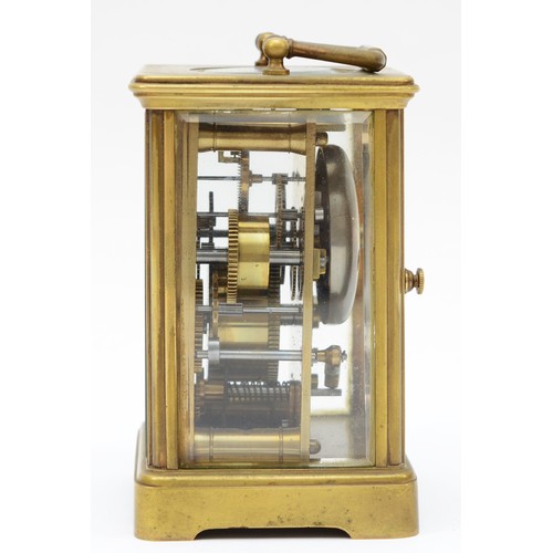 372 - An early 20th century brass and four glass corniche cased striking carriage clock, the white enamell... 