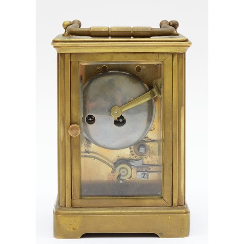 372 - An early 20th century brass and four glass corniche cased striking carriage clock, the white enamell... 