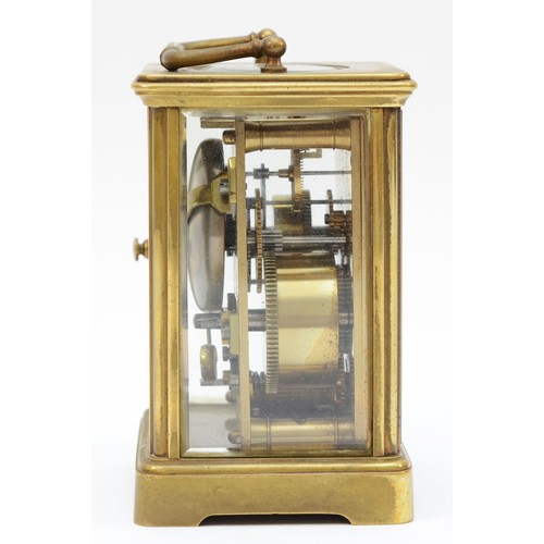 372 - An early 20th century brass and four glass corniche cased striking carriage clock, the white enamell... 