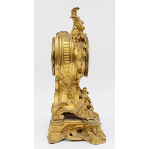 376 - A late 19th century, probably French gilt brass mantle clock, the gilt dial with applied enamel Roma... 