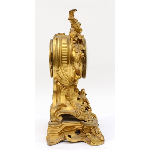 376 - A late 19th century, probably French gilt brass mantle clock, the gilt dial with applied enamel Roma... 