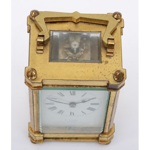 379 - E. White 12 Haymarket London, a 20th century brass and glass corniche cased striking carriage clock,... 