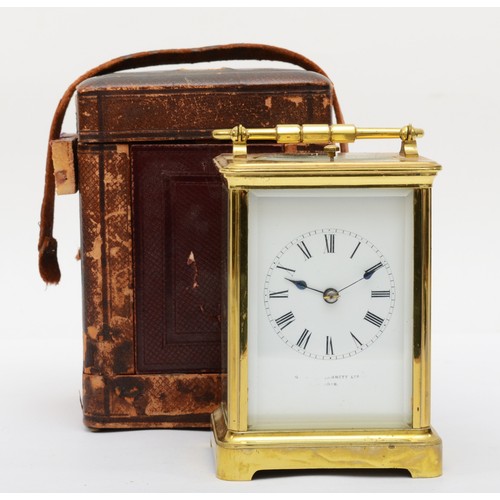 382 - A 20th century French brass and glass corniche cased repeat striking carriage clock, the white dial ... 