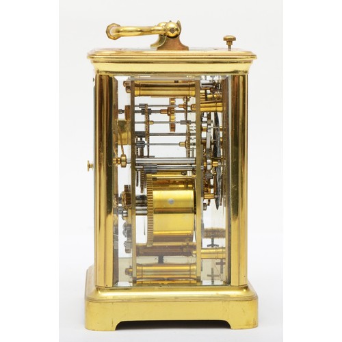 382 - A 20th century French brass and glass corniche cased repeat striking carriage clock, the white dial ... 