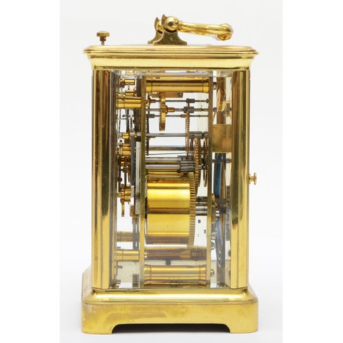 382 - A 20th century French brass and glass corniche cased repeat striking carriage clock, the white dial ... 