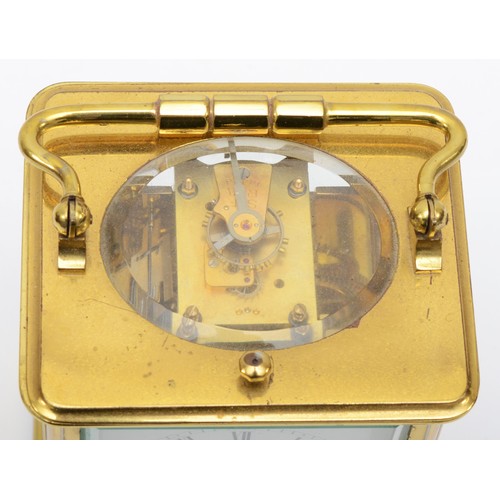 382 - A 20th century French brass and glass corniche cased repeat striking carriage clock, the white dial ... 