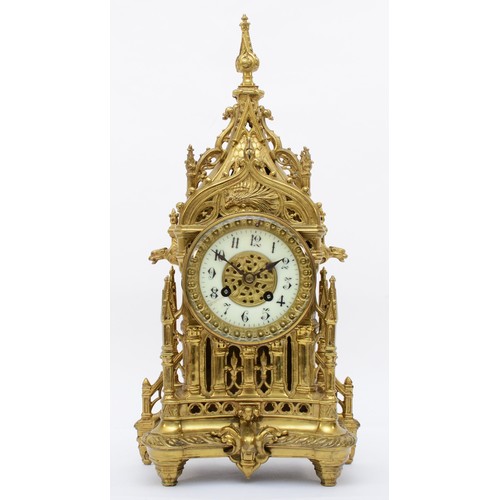 386 - A late 19th/early 20th century gilt brass Architectural mantle clock, cast in the from of a Gothic s... 