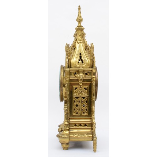 386 - A late 19th/early 20th century gilt brass Architectural mantle clock, cast in the from of a Gothic s... 