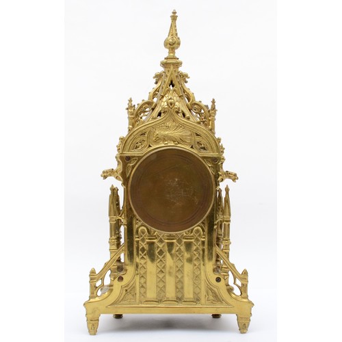 386 - A late 19th/early 20th century gilt brass Architectural mantle clock, cast in the from of a Gothic s... 