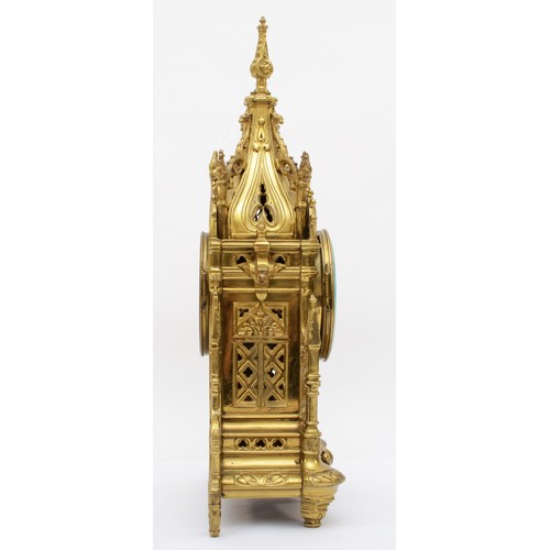 386 - A late 19th/early 20th century gilt brass Architectural mantle clock, cast in the from of a Gothic s... 