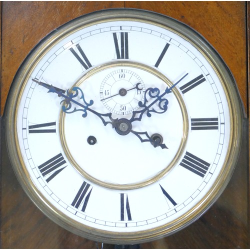 389 - A 19th century walnut cased Vienna style regulator wall clock, the white dial with black Roman numer... 