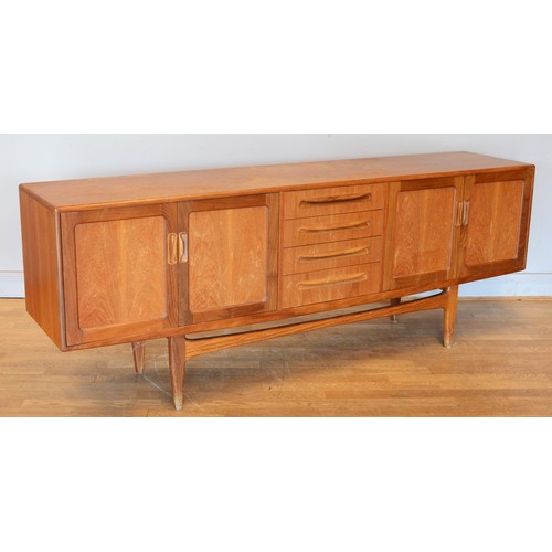 430 - Victor Wilkins for G-Plan, a mid 20th century teak sideboard with four central drawers flanked by tw... 