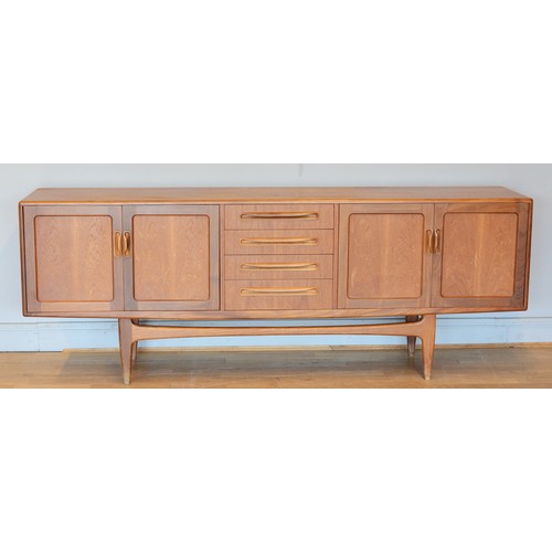 430 - Victor Wilkins for G-Plan, a mid 20th century teak sideboard with four central drawers flanked by tw... 