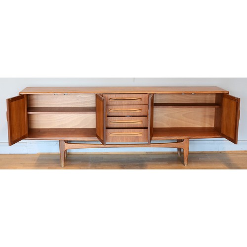 430 - Victor Wilkins for G-Plan, a mid 20th century teak sideboard with four central drawers flanked by tw... 