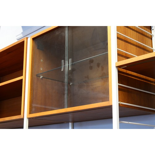 432 - Staples Ladderax, a mid 20th century c1973 three white painted metal and teak three bay modular room... 