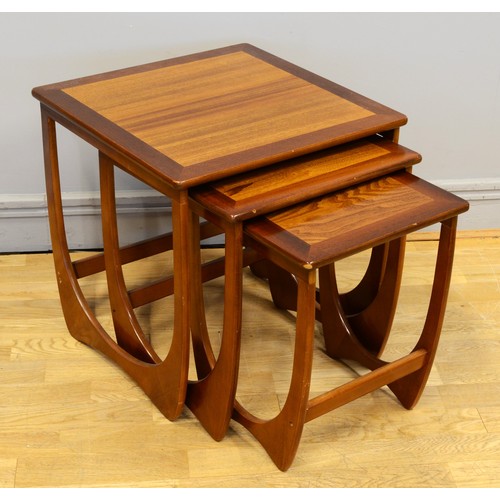 433 - Victor B. Wilkins for G-Plan, a nest of three teak Quadrille design tables, with hoop style framed s... 