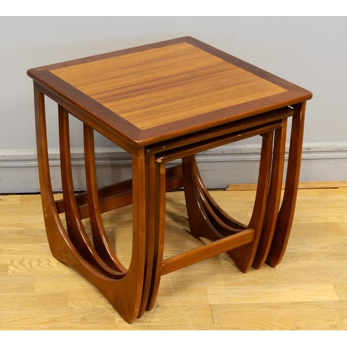 433 - Victor B. Wilkins for G-Plan, a nest of three teak Quadrille design tables, with hoop style framed s... 