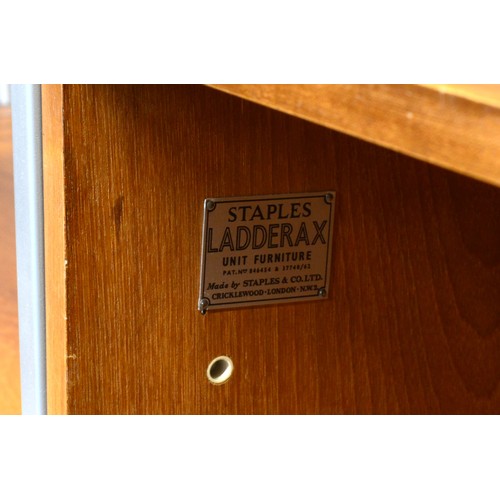 434 - Staples Ladderax, a mid 20th century teak and grey painted modular room unit, two cabinets each with... 