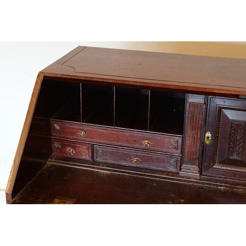 436 - A late 19th century carved mahogany fall front bureau, opening to reveal fitted interior with four g... 