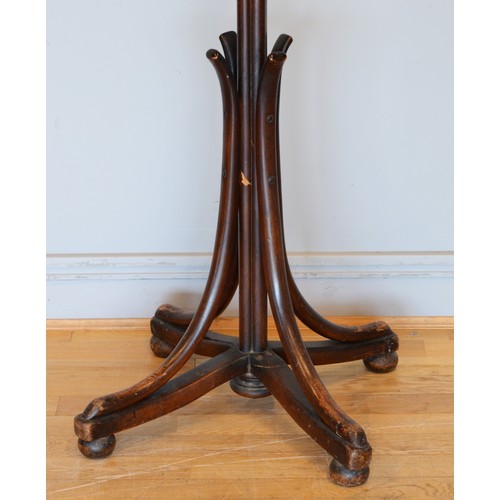 437 - A 20th century Thonet style Bentwood hat and coat stand, raised on four outswept supports terminatin... 