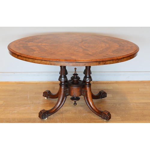 439 - A late Victorian inlaid walnut oval loo table stamped Bros, raised on quadruple carved Greek Key and... 