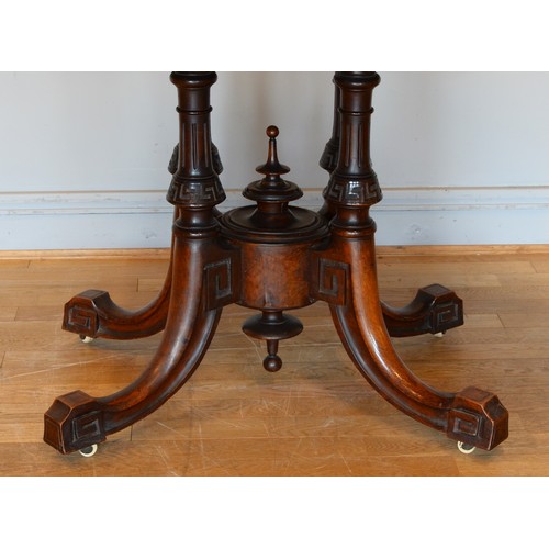 439 - A late Victorian inlaid walnut oval loo table stamped Bros, raised on quadruple carved Greek Key and... 