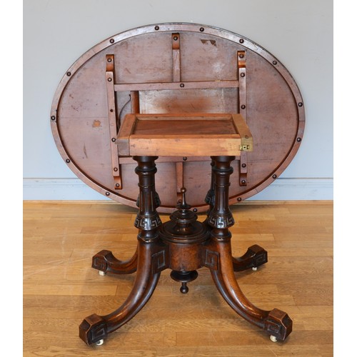 439 - A late Victorian inlaid walnut oval loo table stamped Bros, raised on quadruple carved Greek Key and... 