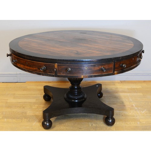 440 - A 19th century Rosewood circular drum table, raised on central fluted urn support standing quad base... 