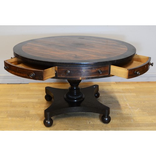 440 - A 19th century Rosewood circular drum table, raised on central fluted urn support standing quad base... 