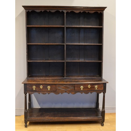 444 - A George III and later adapted oak dresser, with open shelf back raised on twin drawer base with bra... 