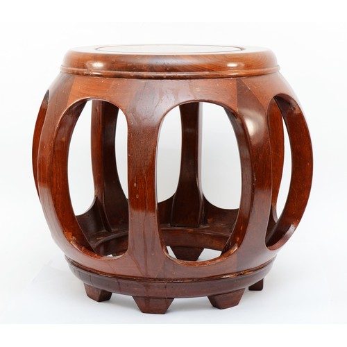 446 - A 20th century Chinese circular topped hardwood stand, with pierced sides, 35cm high.