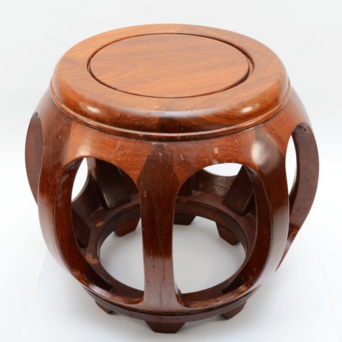 446 - A 20th century Chinese circular topped hardwood stand, with pierced sides, 35cm high.